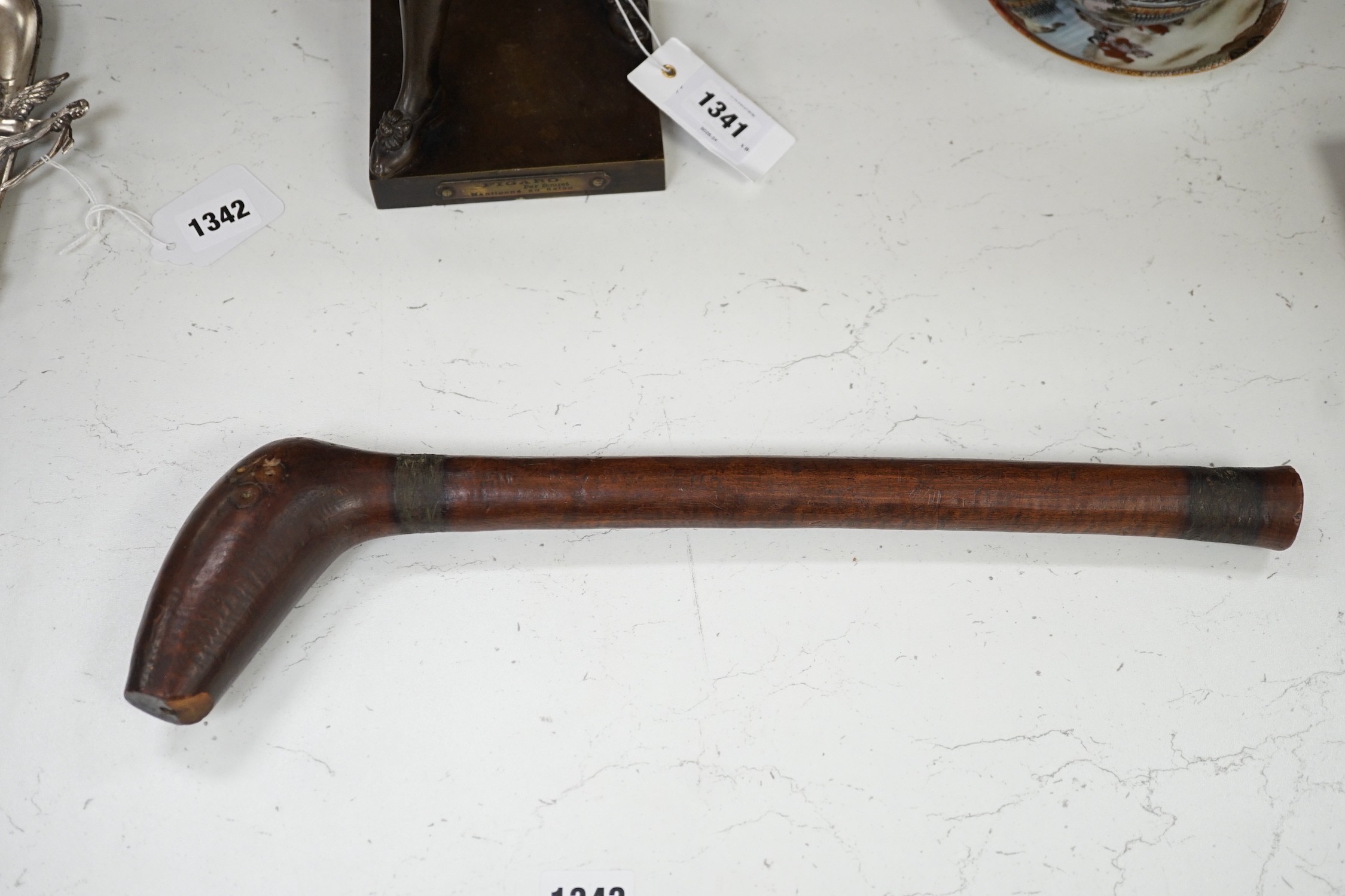 A Polynesian wood throwing club, 40cm tall
